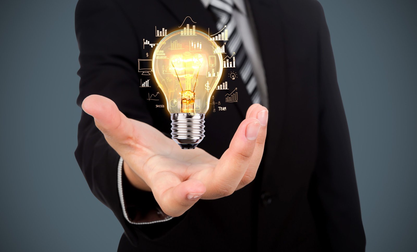 businessman with light bulb his hand scaled